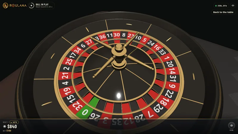 The roulette wheel close up, the ball high on the track